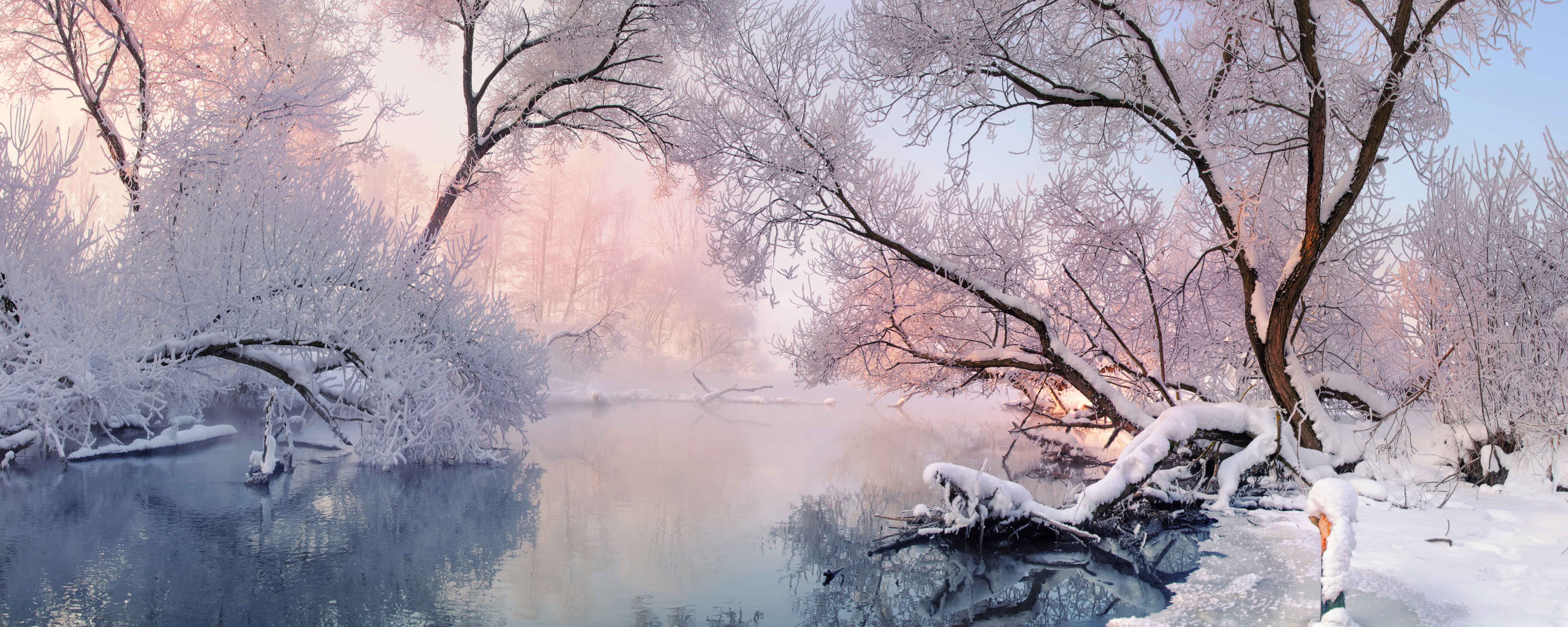 Picture of a snowy lake at sunrise.