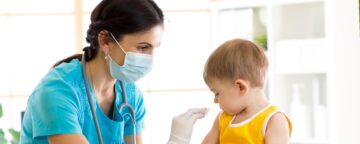 Photo of doctor about to vaccinate a child. For story on MMR vaccine.