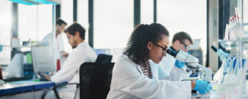 Photo of group of scientists working in a lab.