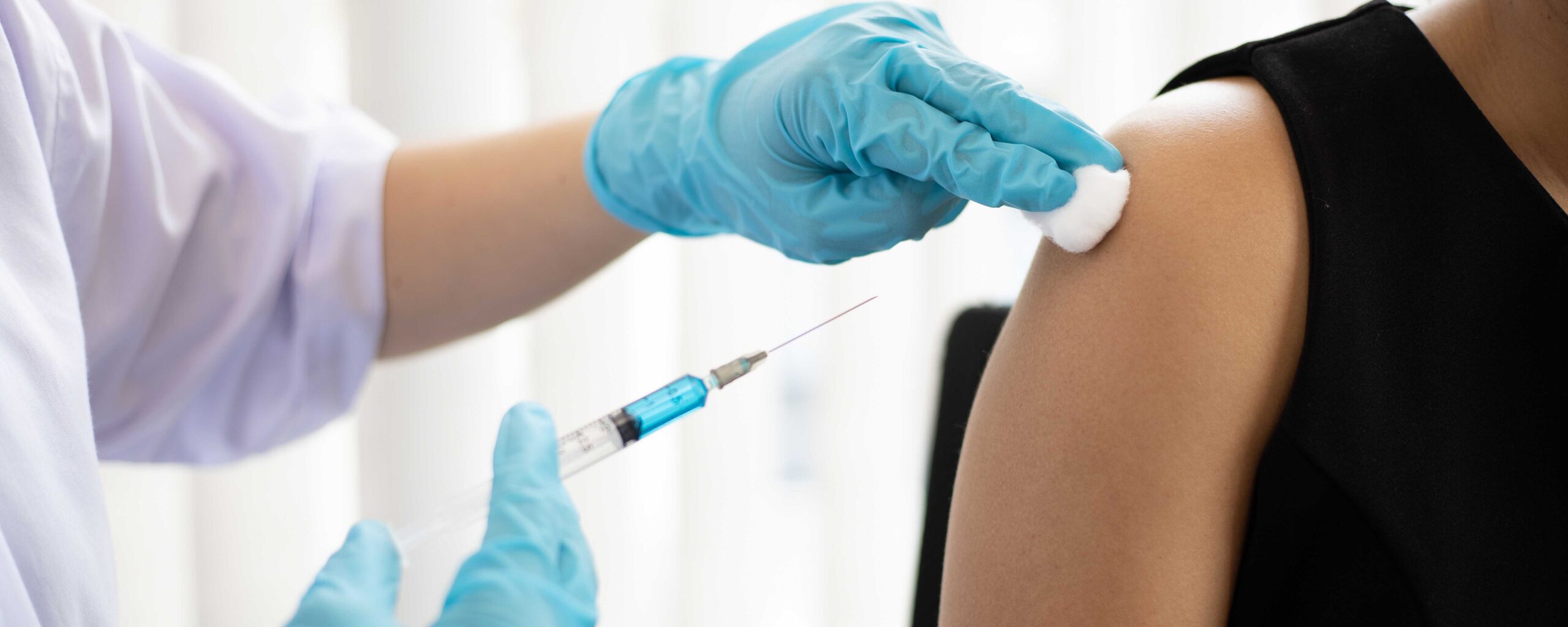 A photo of someone getting a vaccine. A "conspiracy mindset" was a major factor in vaccine resistance during the pandemic.