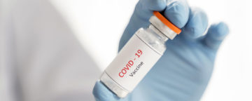 Stock image of COVID-19 vaccination vial.