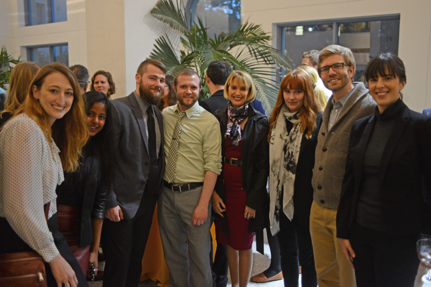 Marcia McNutt (center) poses for a photo with APPC postdocs (l-to-r) Asheley Landrum, Meghnaa Tallapragada, Ben Lyons, Robert Lull, Ariel Hasell, Joe Hilgard, and Heather Akin.