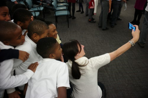 Melissa Murray Bailey takes a selfie with students.