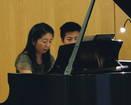 Pianist Reiko Uchida, with Penn student Sibo Wang assisting as page-turner.