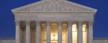 Supreme Court building at dusk.