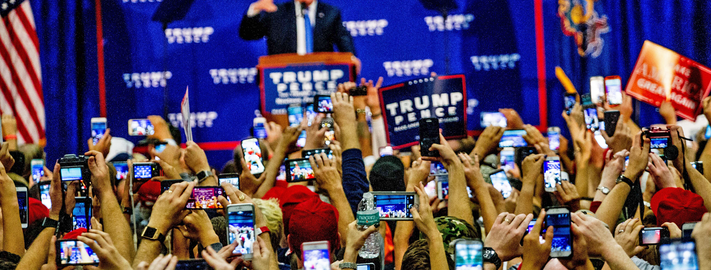 Supporters watch Donald Trump speaking at a rally in Newtown, Bucks County, PA on October 21, 2016. Credit: Michael Candelori.