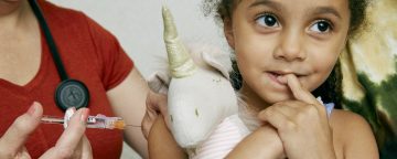 Girl about to receive a vaccination.