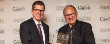 KUSA's Brandon Rittiman is presented with the 2015 Cronkite/Jackson Prize by FactCheck.org's founding director, Brooks Jackson.