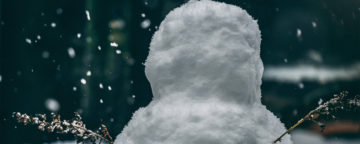 Lone snowperson at night. Credit: Matt Seymour/Unsplash.