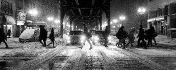 People on a busy wintry street.