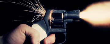 A handgun being fired