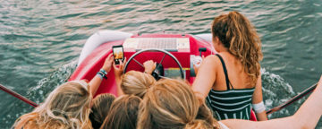 Adolescent risk-taking? Teens driving a boat and taking a selfie. Credit: Daan Stevens/Unsplash.