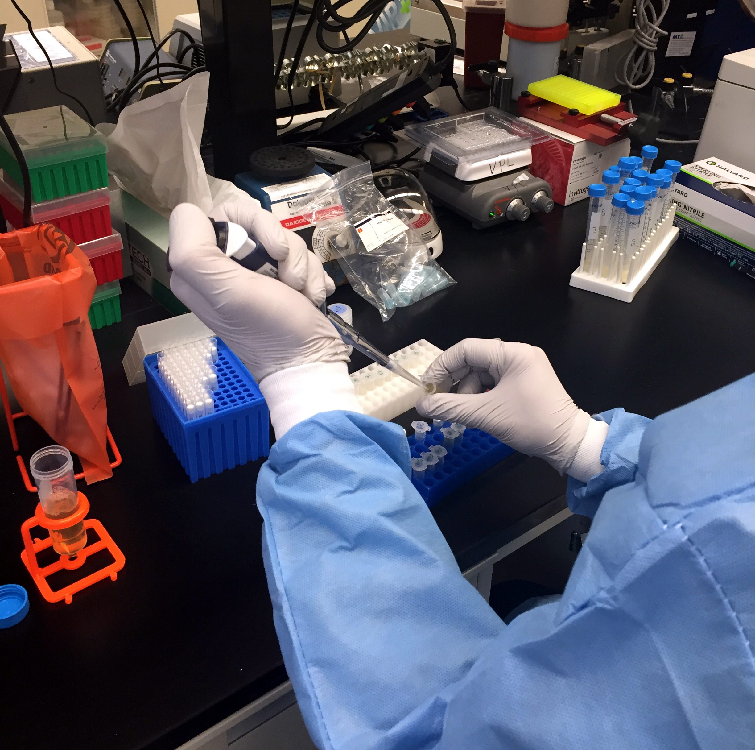 A Zika virus researcher at the NIAID Vaccine Research Center pipets samples. Credit: NIAID.